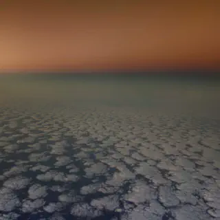 Picture out of the airplane sunset above the clouds